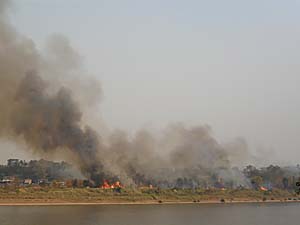Bush Fires on a Mekong Island by Asienreisender