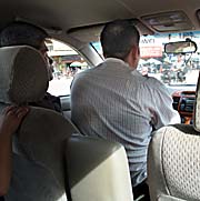 'Cambodian Driver with a Passenger on his Seat' by Asienreisender