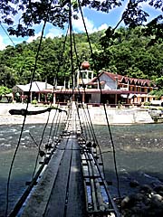 'A Suspension Bridge over the Bohorok River in Bukit Lawang' by Asienreisender