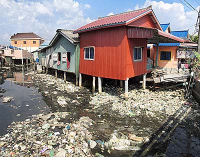 'Garbage in a Canal' by Asienreisender
