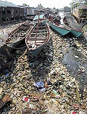 'Fishing Boats, swimming in Garbage' by Asienreisender