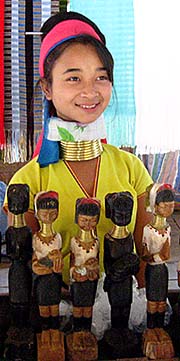 'A Kayan Girls with Brass Bracelet in a Souvenir Shop in Ban Nai Soi' by Asienreisender