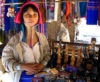 'A Kayan Woman with a Brass Coil in a Shop in Nai Soi Village' by Asienreisender