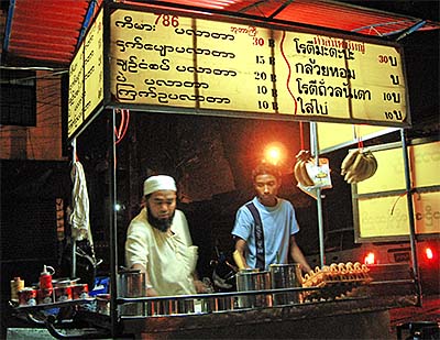 'A Street Food Vendor in Tachileik / Burma / Myanmar' by Asienreisender
